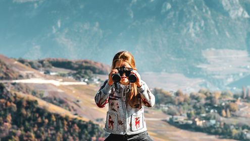 girl holding binoculars