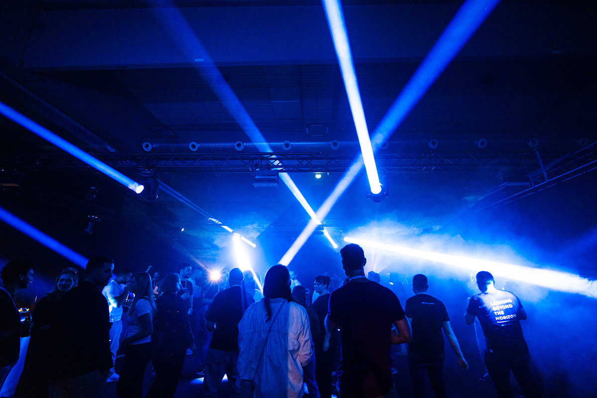 Photo showing NETCONOMY colleagues at the after-party area of the NETCONOMY Summit 2025.